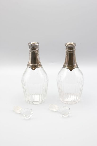 Pair of crystal carafes with coast.
Silver...