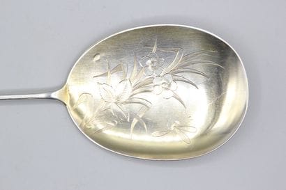 Silver serving ice-cream scoop with a vermeil...