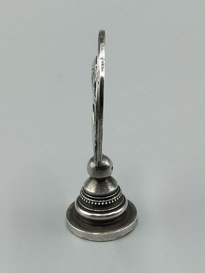 Silver seal representing Joan of Arc in armor...
