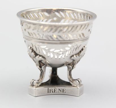 Silver egg cup with three clawed feet with...