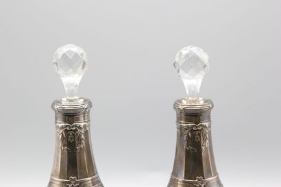 Pair of crystal carafes with coast.
Silver...