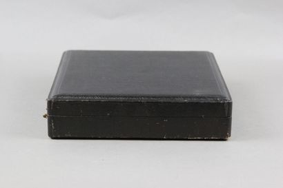 Wooden box with leather on the top of the...
