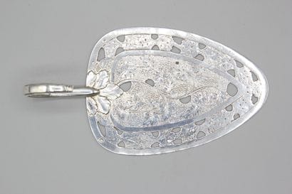 Silver pie plate with chased decoration of...