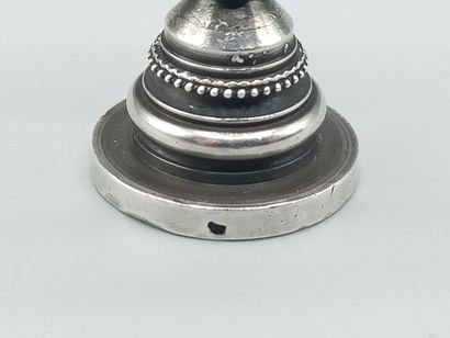 Silver seal representing Joan of Arc in armor...