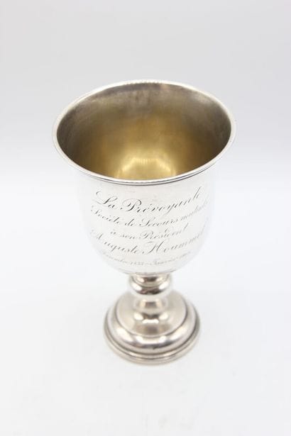 Cup on foot in silver.
On the body is inscribed...