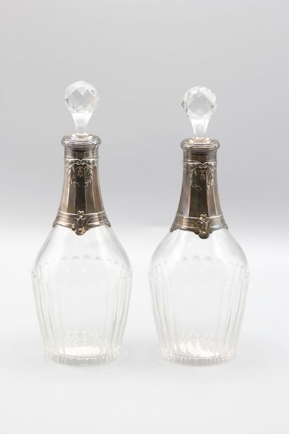 Pair of crystal carafes with coast.
Silver...