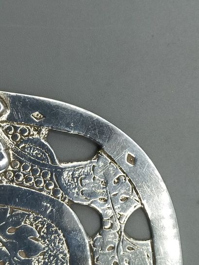 Silver pie plate with chased decoration of...