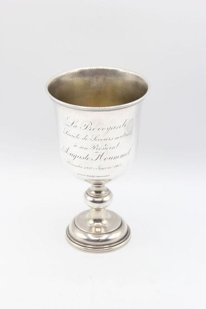Cup on foot in silver.
On the body is inscribed...