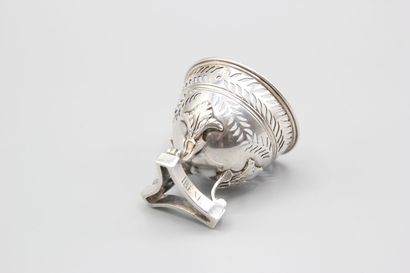 Silver egg cup with three clawed feet with...