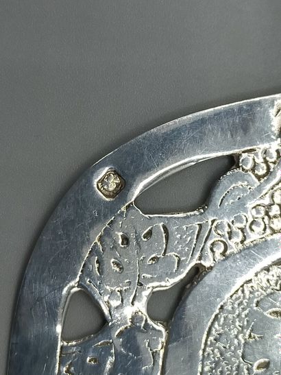 Silver pie plate with chased decoration of...