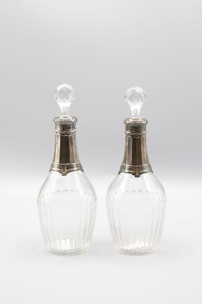 Pair of crystal carafes with coast.
Silver...