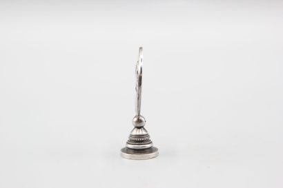 Silver seal representing Joan of Arc in armor...