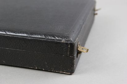 Wooden box with leather on the top of the...