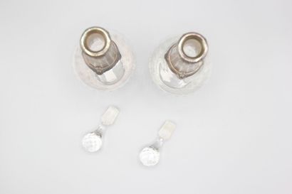 Pair of crystal carafes with coast.
Silver...
