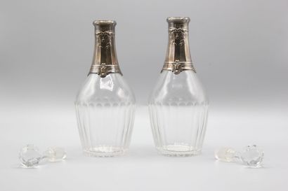 Pair of crystal carafes with coast.
Silver...