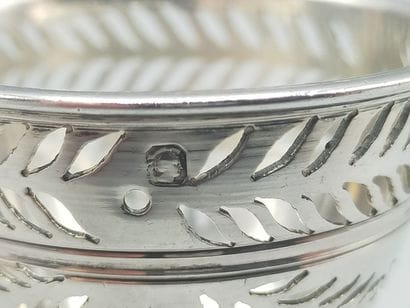 Silver egg cup with three clawed feet with...