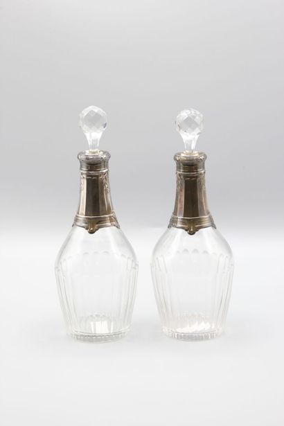 Pair of crystal carafes with coast.
Silver...