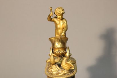 Pendule dite à l'Amour en bronze à deux patines...