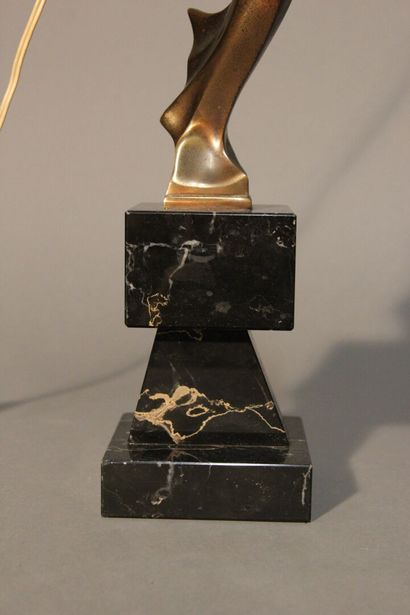 Table lamp in patinated bronze.
Figure a...