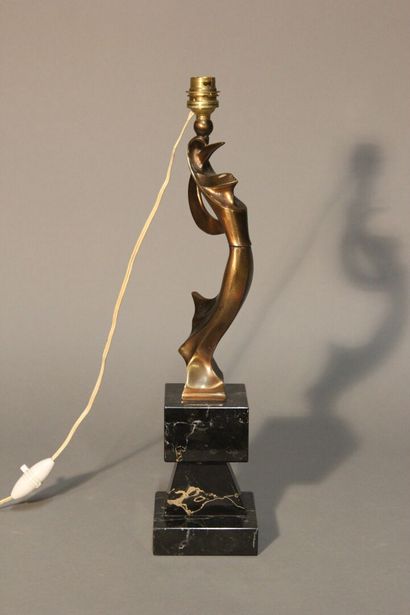 Table lamp in patinated bronze.
Figure a...