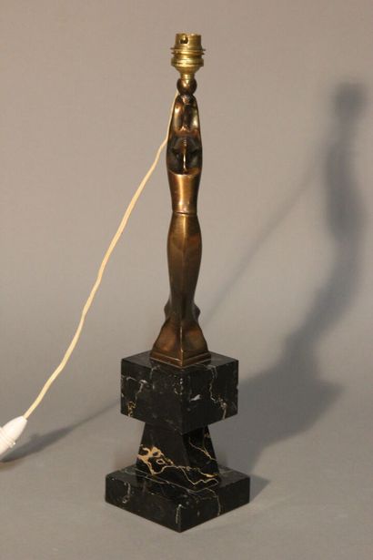 Table lamp in patinated bronze.
Figure a...