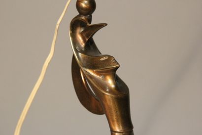Table lamp in patinated bronze.
Figure a...