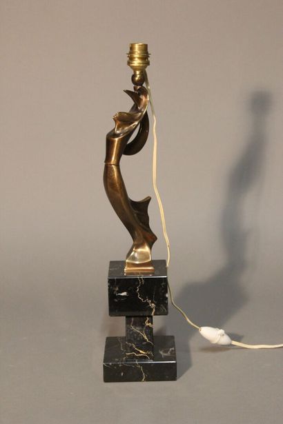 Table lamp in patinated bronze.
Figure a...