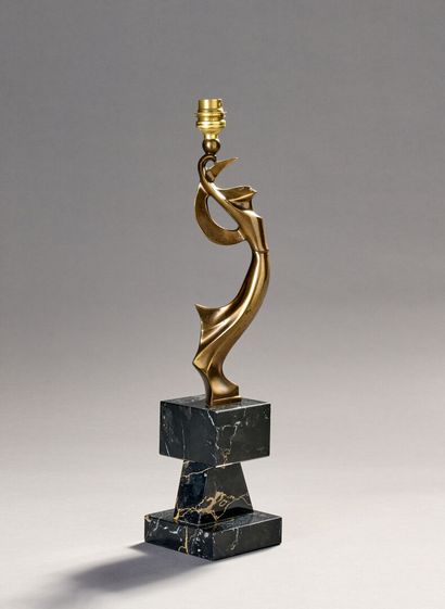 Table lamp in patinated bronze.
Figure a...