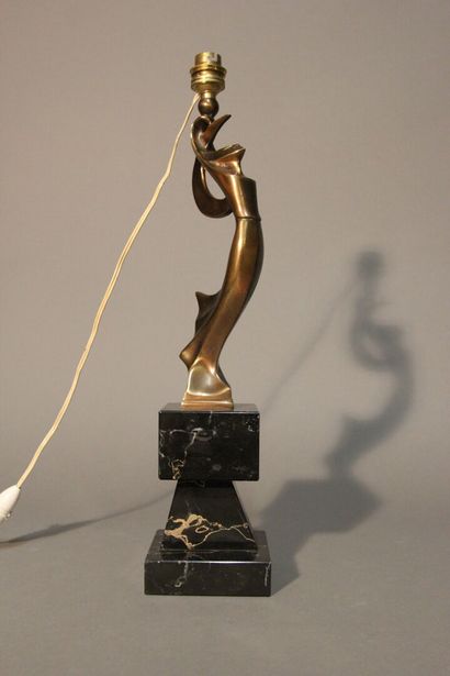 Table lamp in patinated bronze.
Figure a...
