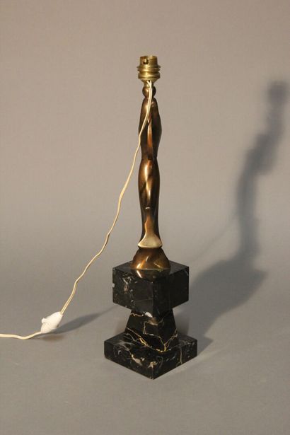 Table lamp in patinated bronze.
Figure a...