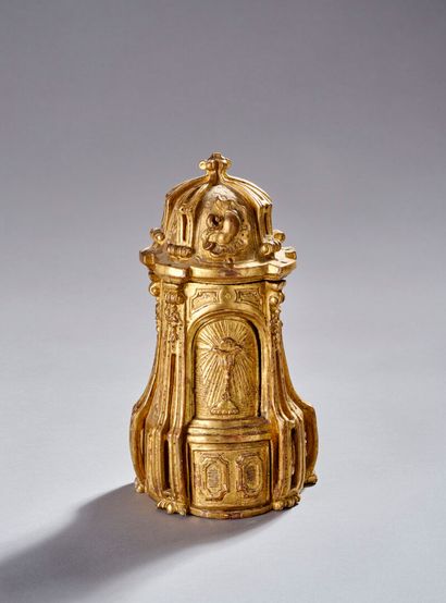 Curious reliquary in carved gilded wood.
Featuring...