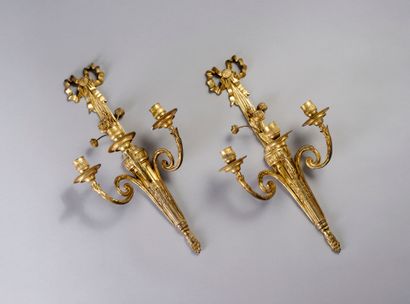 Pair of ormolu and chased sconces with three...