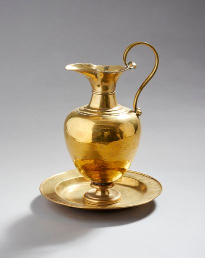 Brass ewer and basin.
The neck is outlined...