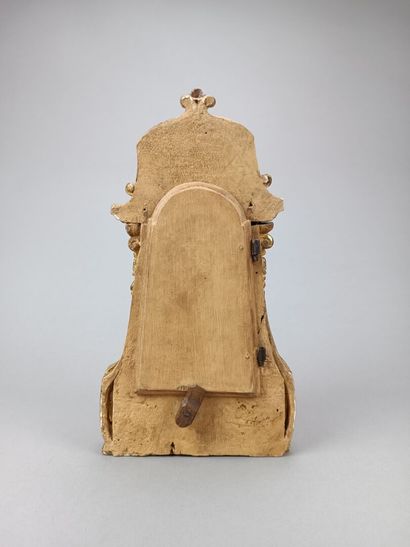 Curious reliquary in carved gilded wood.
Featuring...
