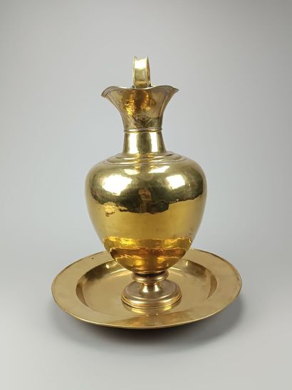 Brass ewer and basin.
The neck is outlined...