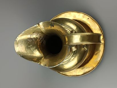 Brass ewer and basin.
The neck is outlined...