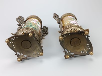 Pair of enameled glass scroll vases.
Decorated...