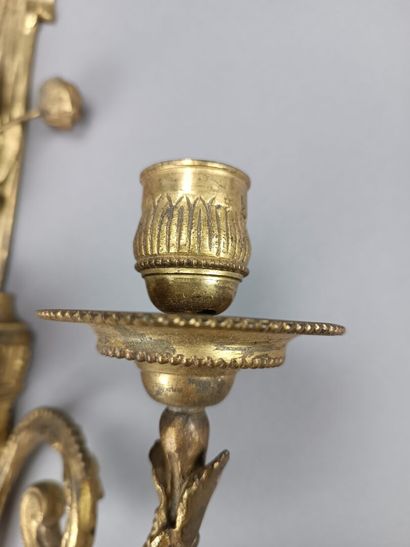 Pair of ormolu and chased sconces with three...