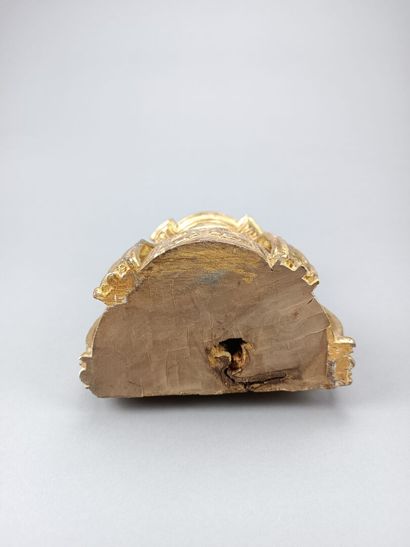 Curious reliquary in carved gilded wood.
Featuring...