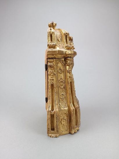 Curious reliquary in carved gilded wood.
Featuring...