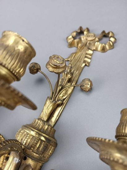 Pair of ormolu and chased sconces with three...
