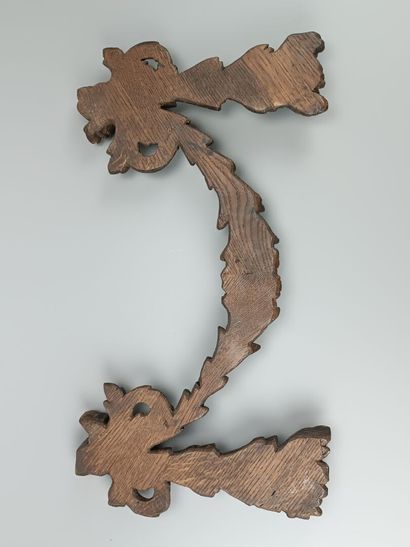 Decorative element in carved wood depicting...