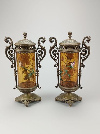 Pair of enameled glass scroll vases.
Decorated...