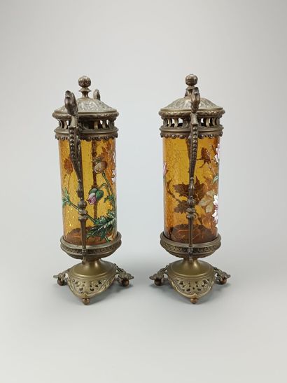 Pair of enameled glass scroll vases.
Decorated...