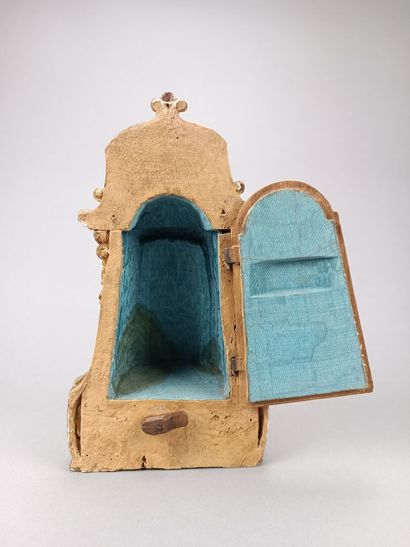 Curious reliquary in carved gilded wood.
Featuring...