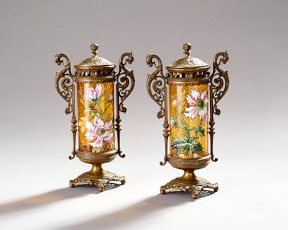 Pair of enameled glass scroll vases.
Decorated...