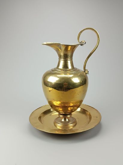 Brass ewer and basin.
The neck is outlined...