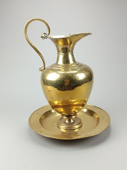 Brass ewer and basin.
The neck is outlined...