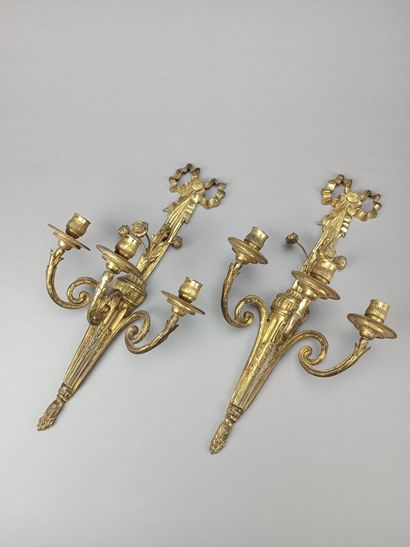 Pair of ormolu and chased sconces with three...