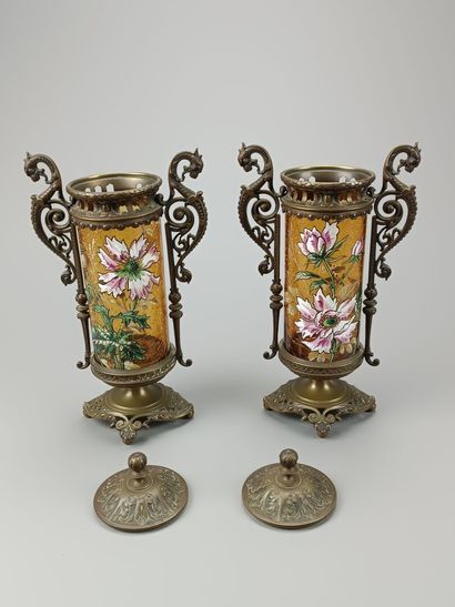 Pair of enameled glass scroll vases.
Decorated...